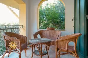 a porch with a table and chairs and a window at Casa dell'Artista - Ampio appartamento in zona tranquilla e centrale in Iglesias +83 photos