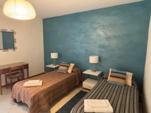 A bed or beds in a room at Ali
