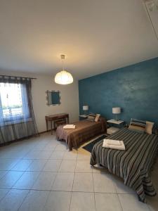 A bed or beds in a room at Ali