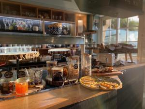 a kitchen with a counter with food on it at Hotel du Centre - Chez Janie in Roscoff