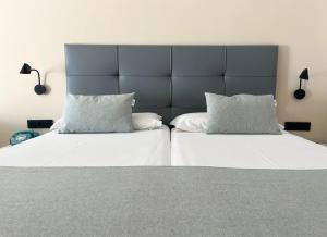 Postel nebo postele na pokoji v ubytování Hotel Las Costas