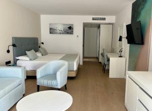 Postel nebo postele na pokoji v ubytování Hotel Las Costas