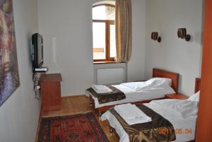 Кровать или кровати в номере Lahıc Guesthouse