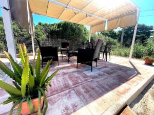 Φωτογραφία από το άλμπουμ του Appartamento in Villa con giardino (2) σε Porto Torres