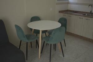 A kitchen or kitchenette at Apartamentos Fayna
