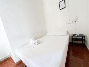 Postel nebo postele na pokoji v ubytování LÀtic Rooms