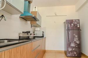 Η κουζίνα ή μικρή κουζίνα στο Tranquil 2BHK Serviced Apartment in Siolim
