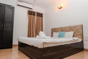 Ένα ή περισσότερα κρεβάτια σε δωμάτιο στο Tranquil 2BHK Serviced Apartment in Siolim +27 φωτογραφίες