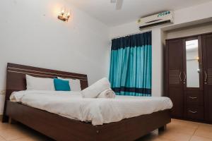 Ένα ή περισσότερα κρεβάτια σε δωμάτιο στο Tranquil 2BHK Serviced Apartment in Siolim