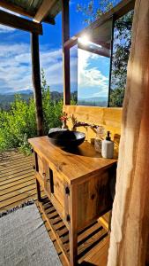 a wooden bathroom with a sink and a window at Melody Hills in Sedgefield