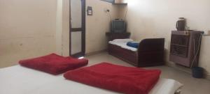 Letto o letti in una camera di Hotel Sangam sagar