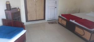 Letto o letti in una camera di Hotel Sangam sagar