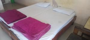 Letto o letti in una camera di Hotel Sangam sagar