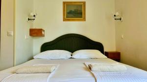 Postel nebo postele na pokoji v ubytování Apartments - Villa Sidro