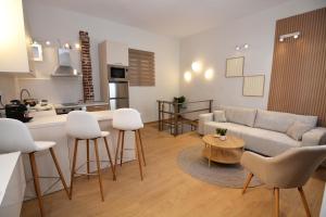 a living room with a couch and a table at Liora Retreat in Kavála