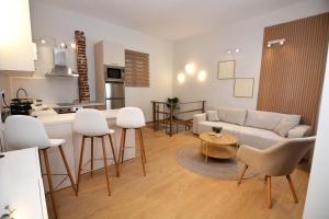 a kitchen and a living room with a couch and a table at Liora Retreat in Kavála +13 photos