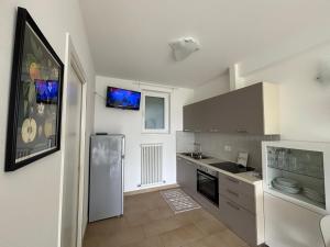 Kuchyň nebo kuchyňský kout v ubytování Un Balcone sul Garda