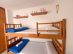 a room with two bunk beds in a room at Apartamentos Mar Bella Segur de Calafell 3000 in Segur de Calafell