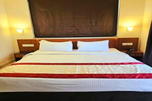 Postel nebo postele na pokoji v ubytování Hotel Jubilant
