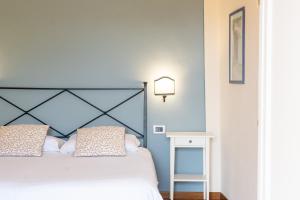 Voodi või voodid majutusasutuse Hotel Le Colline toas