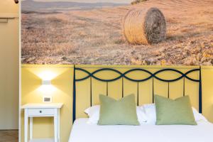 Voodi või voodid majutusasutuse Hotel Le Colline toas