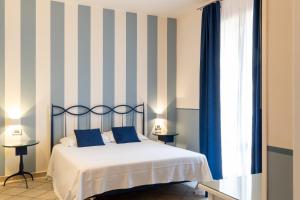 Voodi või voodid majutusasutuse Hotel Le Colline toas