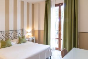 Voodi või voodid majutusasutuse Hotel Le Colline toas