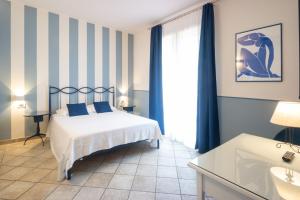 Voodi või voodid majutusasutuse Hotel Le Colline toas