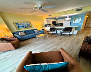 a living room with a couch and a table at Wyndham Ocean Walk 703 - Vacation in Comfort and luxury 1BR Oceanfront in Daytona Beach