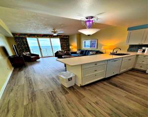a kitchen with a sink and a counter top at Wyndham Ocean Walk 703 - Vacation in Comfort and luxury 1BR Oceanfront in Daytona Beach