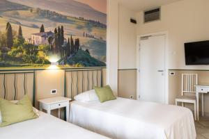 Voodi või voodid majutusasutuse Hotel Le Colline toas