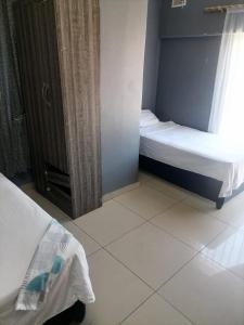 Ένα ή περισσότερα κρεβάτια σε δωμάτιο στο Mabhida accommodation