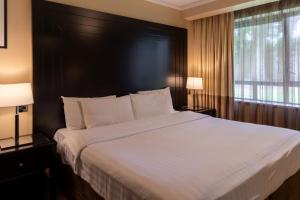 Katil atau katil-katil dalam bilik di Shamrock Lodge Hotel