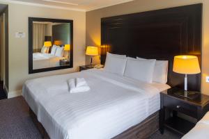 Katil atau katil-katil dalam bilik di Shamrock Lodge Hotel