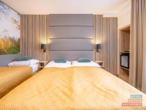 Letto o letti in una camera di Hotel Benica