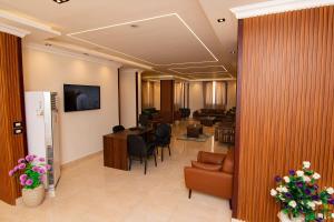TV a/nebo společenská místnost v ubytování Three Pyramids Boutique Hotel