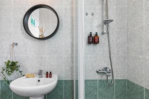 a bathroom with a shower and a sink and a mirror at Royal Seacrest amazing location 2 Bed Apartment by VICHY Holidays in Paphos +31 photos