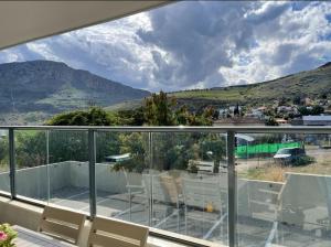 a balcony with a view of a mountain at Welcome to Sunshine in Migdal