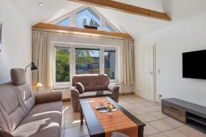 Et opholdsområde på Bungalow Lemke mit Terasse