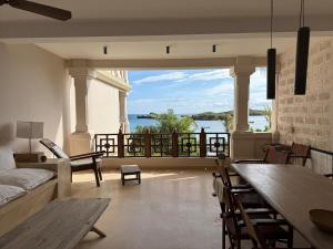 a living room with a view of the water at Casa Sanaa - Sea view in Watamu
