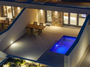 The swimming pool at or close to Illusion Suites