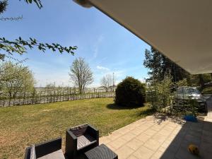 a view of a backyard with a fence at Luxee Apartment in Friedrichshafen