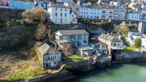 an aerial view of a house on the water at Riverside Apartment with Stunning Views & Patio in Dartmouth