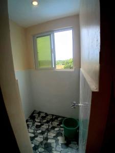 Ένα μπάνιο στο Janet Apartment & Transient House