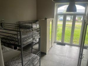 Ένα ή περισσότερα κρεβάτια σε δωμάτιο στο Dortoir de 12Lits +1 φωτογραφίες