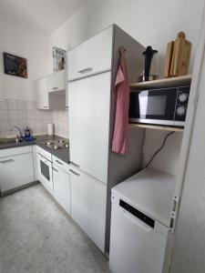 Kuchyň nebo kuchyňský kout v ubytování Ara Monteurszimmer + 15 fotografií