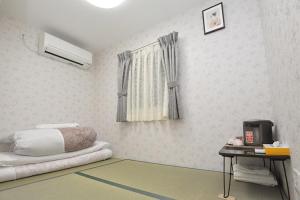 Postel nebo postele na pokoji v ubytování BJ family inn