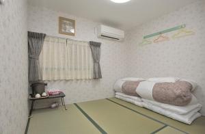 Postel nebo postele na pokoji v ubytování BJ family inn + 16 fotografií