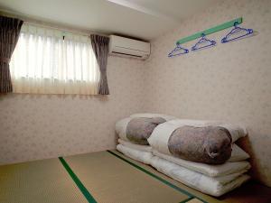 Postel nebo postele na pokoji v ubytování BJ family inn