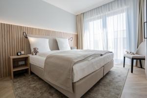 Postel nebo postele na pokoji v ubytování Yachthafen Barth - Ferienwohnung und Penthouses